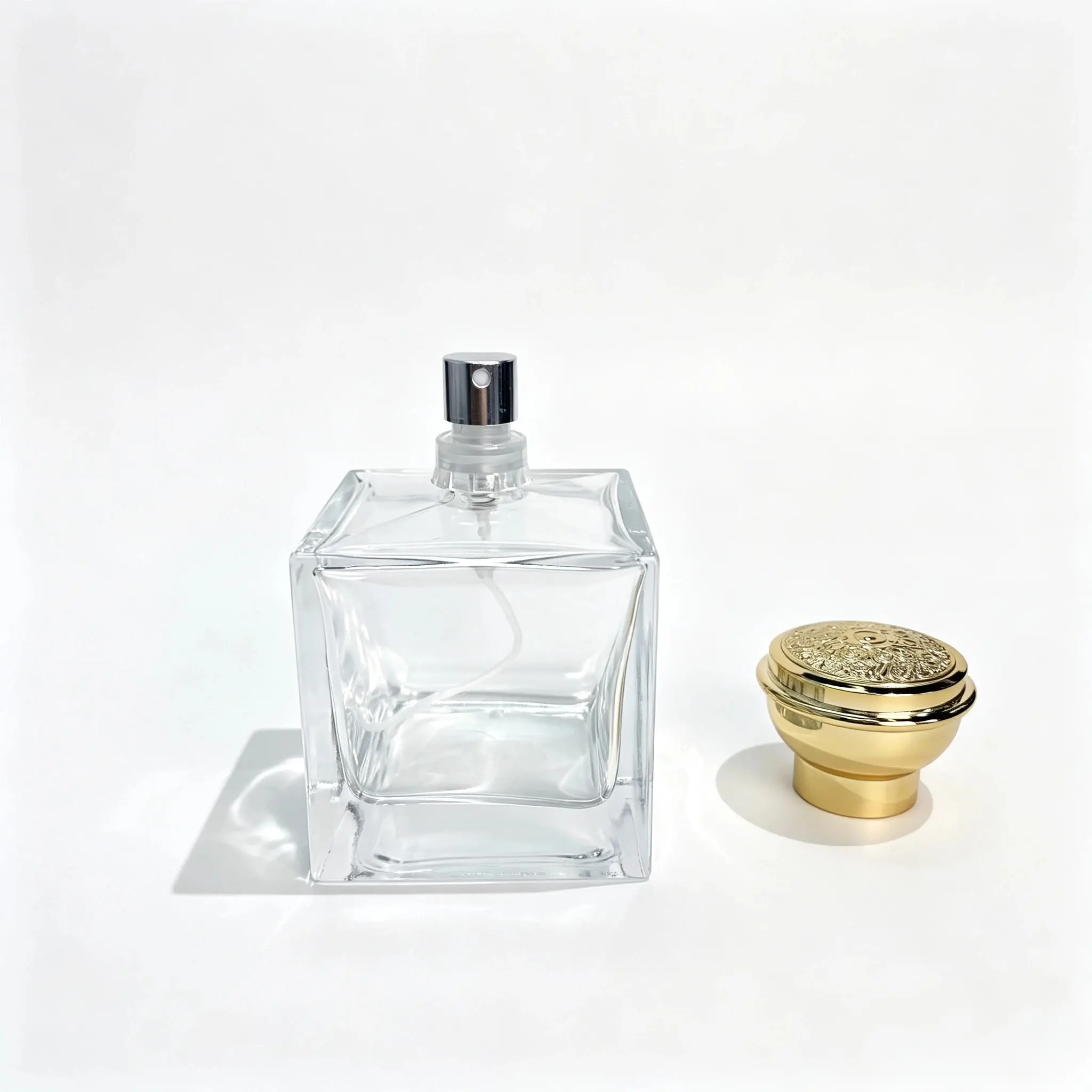 100ml Square Heavy Base Perfume Bottle Without Cap 100ml square heavy base perfume bottle shown without the cap with the outer cap displayed separately